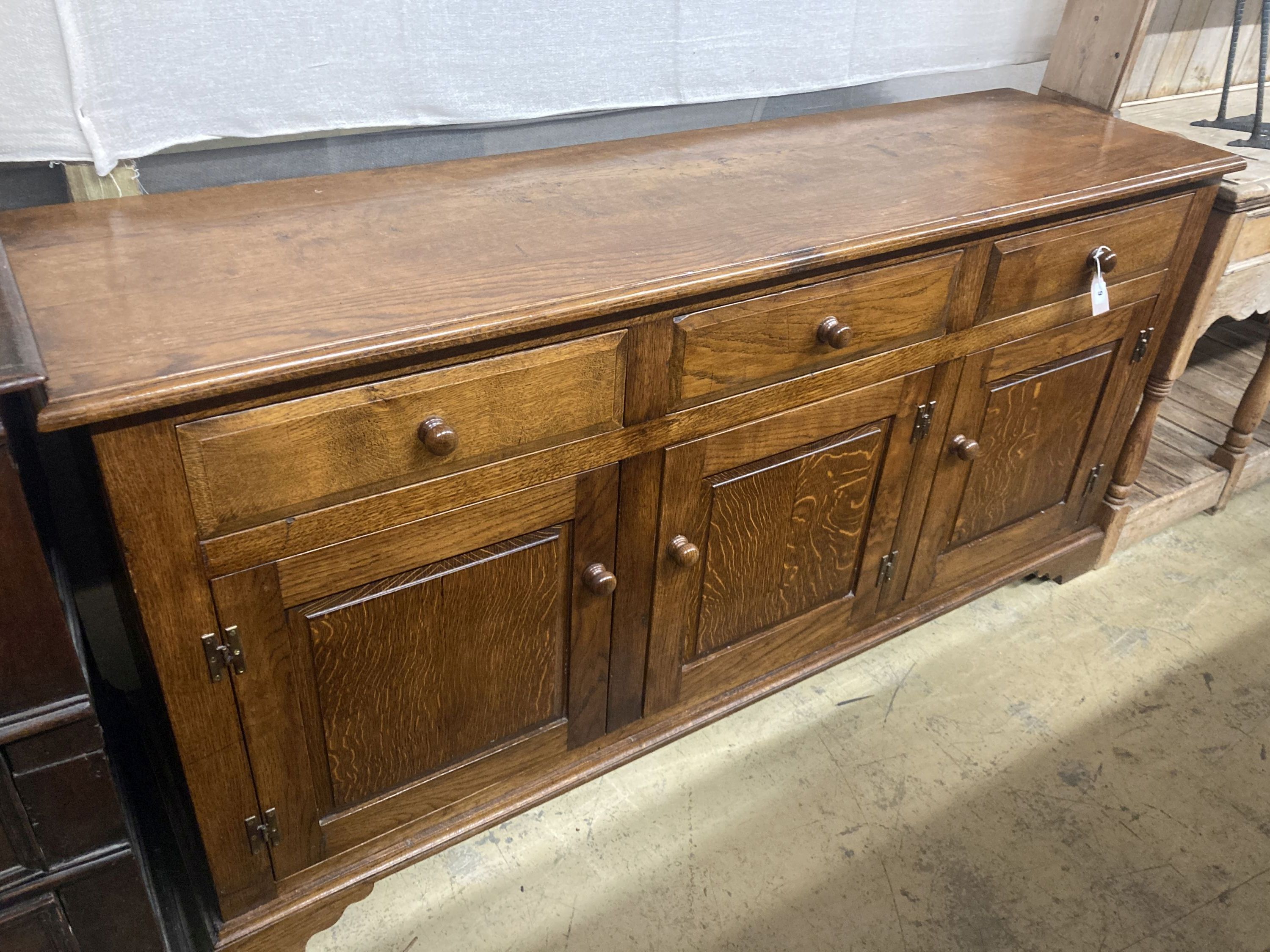 An 18th century style oak low dresser, width 170cm, depth 48cm, height 84cm